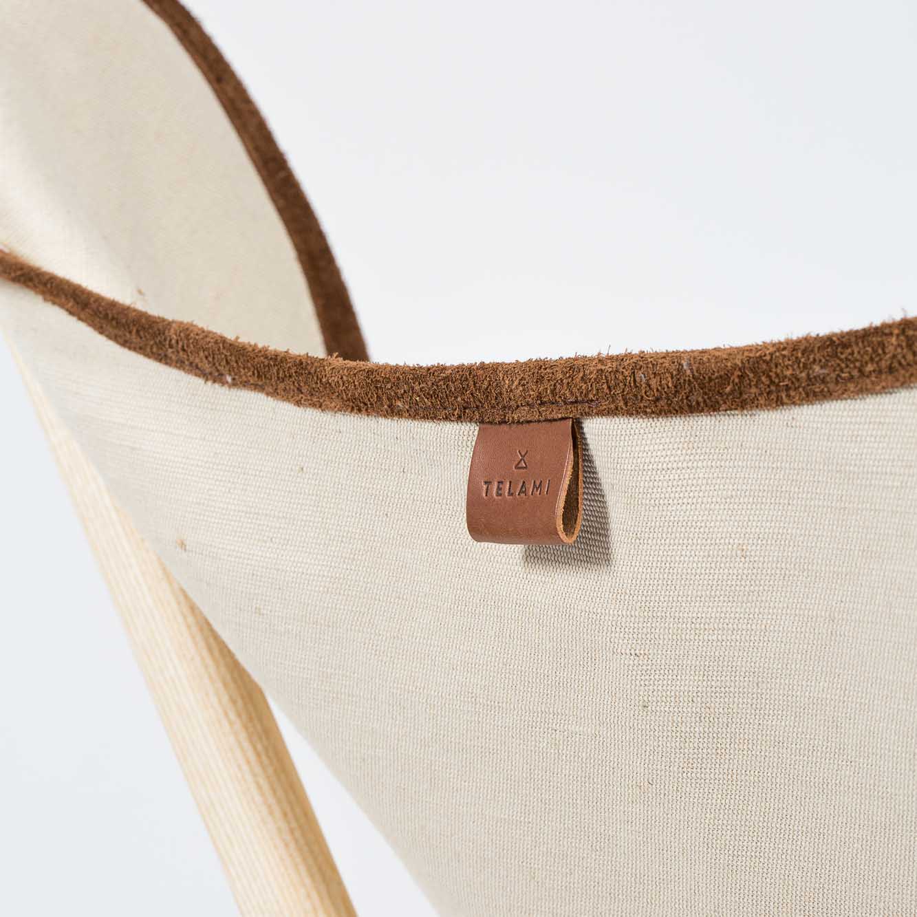 Telami Tripolina is a made in Italy design chair. Telami Tripolina is the original chair. Tripolina Ecru and suede is the iconic armchair, the design legend folding chair and patio chair for outdoor furniture